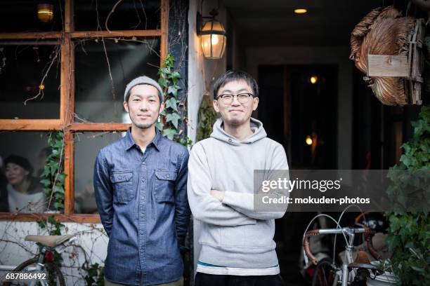 two young men's cafe owners of confident - オーナー imagens e fotografias de stock