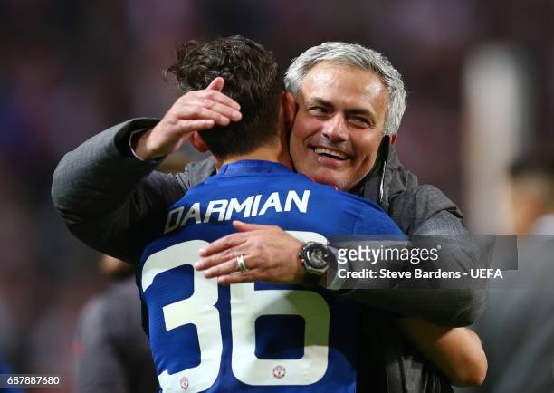 Jose Mourinho, Manager of Manchester United celebrates with Matteo Darmian of Manchester United following victory in the UEFA Europa League Final...