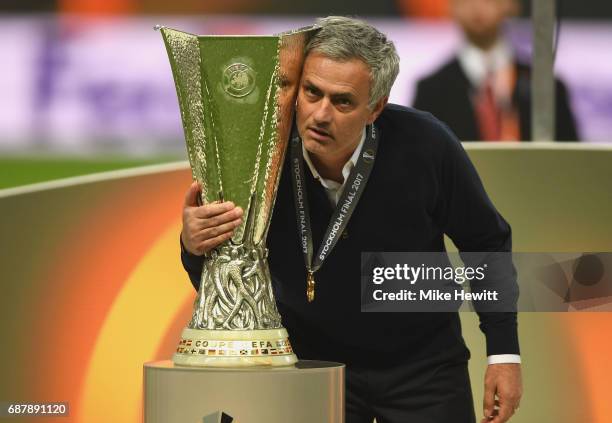 Jose Mourinho, Manager of Manchester United holds the trophy following victory in the UEFA Europa League Final between Ajax and Manchester United at...