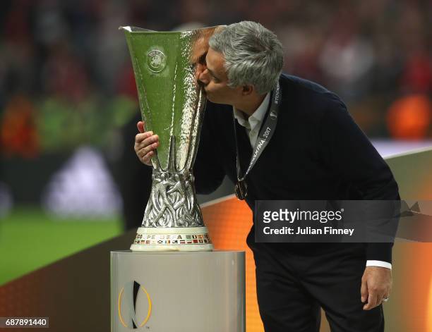 Jose Mourinho, Manager of Manchester United kisses the trophy following victory in the UEFA Europa League Final between Ajax and Manchester United at...