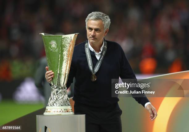 Jose Mourinho, Manager of Manchester United holds the trophy following victory in the UEFA Europa League Final between Ajax and Manchester United at...