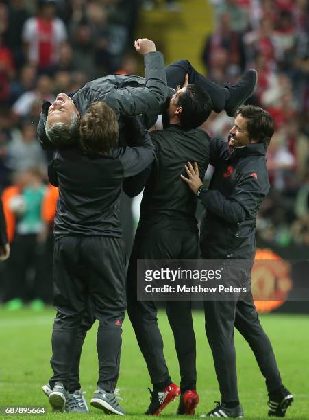 Manager Jose Mourinho of Manchester United celebrates with his coaching staff after the UEFA Europa League Final match between Manchester United and...