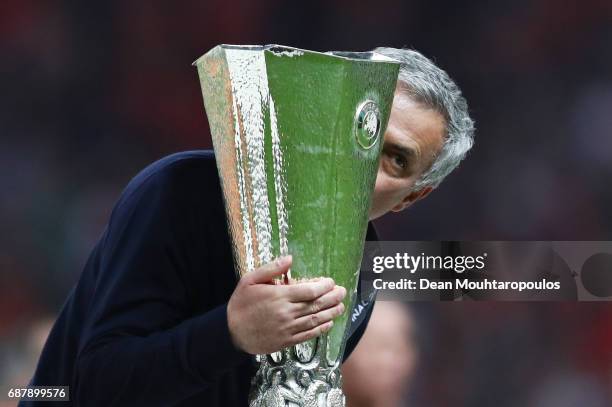 Jose Mourinho, Manager of Manchester United kisses the trophy following victory in the UEFA Europa League Final between Ajax and Manchester United at...