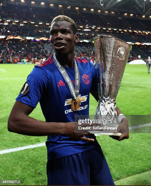 Paul Pogba of Manchester United celebrates with The Europa League trophy after the UEFA Europa League Final between Ajax and Manchester United at...