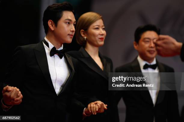 ActorsYim Si-wan, Hye-Jin Jeon and Kim Hee-won attend the "The Merciless " screening during the 70th annual Cannes Film Festival at Palais des...