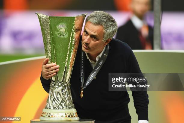 Jose Mourinho, Manager of Manchester United holds the trophy following victory in the UEFA Europa League Final between Ajax and Manchester United at...