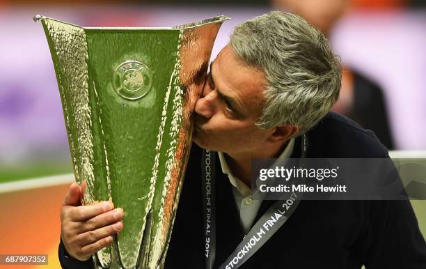 Jose Mourinho, Manager of Manchester United kisses the trophy following victory in the UEFA Europa League Final between Ajax and Manchester United at...