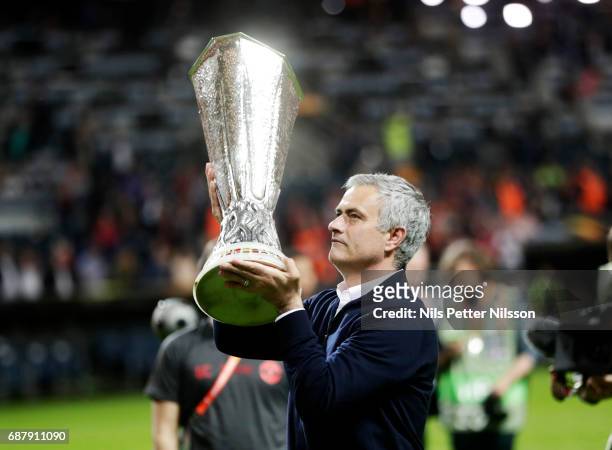 José Mourinho, head coach of Manchester United celebrates after the victory with the trophy during the UEFA Europa League Final between Ajax and...