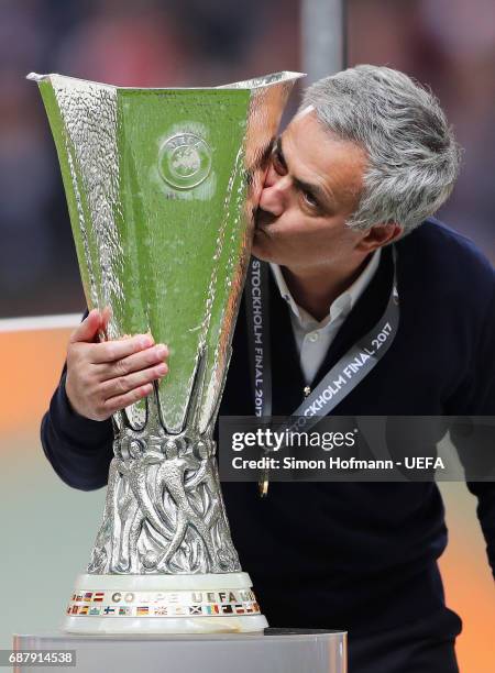 Jose Mourinho, Manager of Manchester United kisses the trophy following victory in the UEFA Europa League Final between Ajax and Manchester United at...