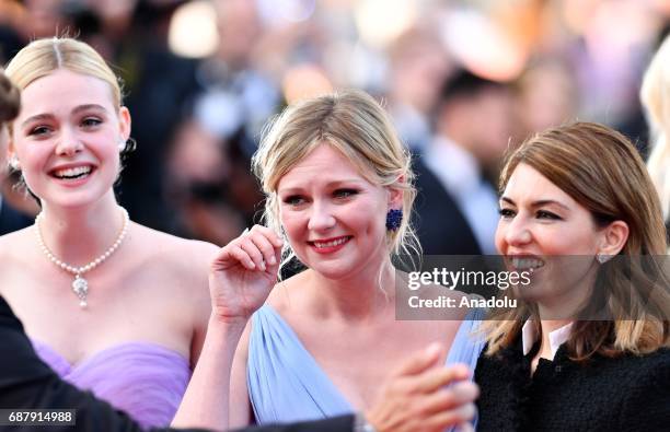 Director Sofia Coppola , US actress Kirsten Dunst and US actress Elle Fanning arrive for the premiere of the film The Beguiled in competition at the...