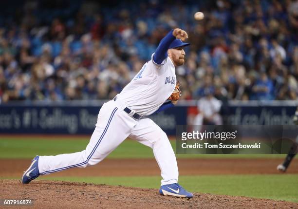 Danny Barnes of the Toronto Blue Jays delivers a pitch in the sixth inning during MLB game action against the Cleveland Indians at Rogers Centre on...
