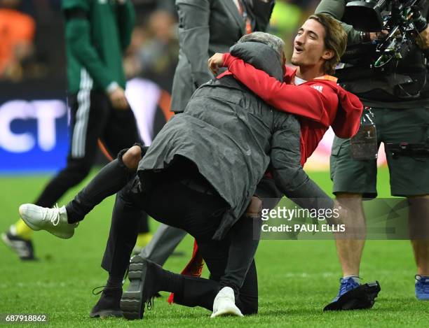 Manchester United's Portuguese manager Jose Mourinho and his son Jose Mourinho celebarate after victory in the UEFA Europa League final football...