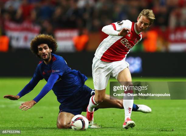 Frenkie de Jong of Ajax gets past Marouane Fellaini of Manchester United during the UEFA Europa League Final between Ajax and Manchester United at...