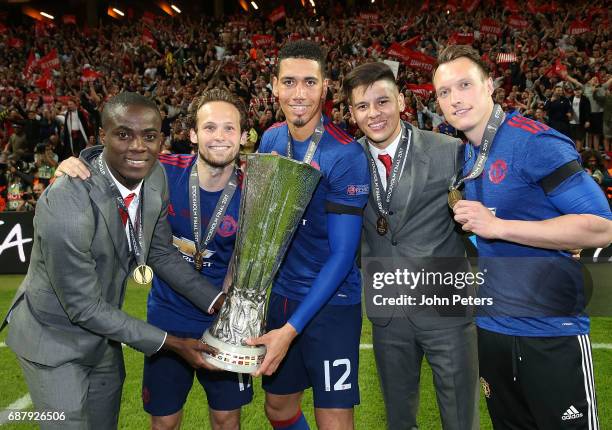 Eric Bailly, Daley Blind, Chris Smalling, Marcos Rojo and Phil Jones of Manchester United celebrate with the Europa League trophy after the UEFA...