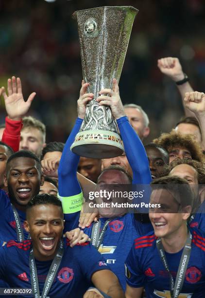 Wayne Rooney of Manchester United lifts the Euroup League trophy after the UEFA Europa League Final match between Manchester United and Ajax at...