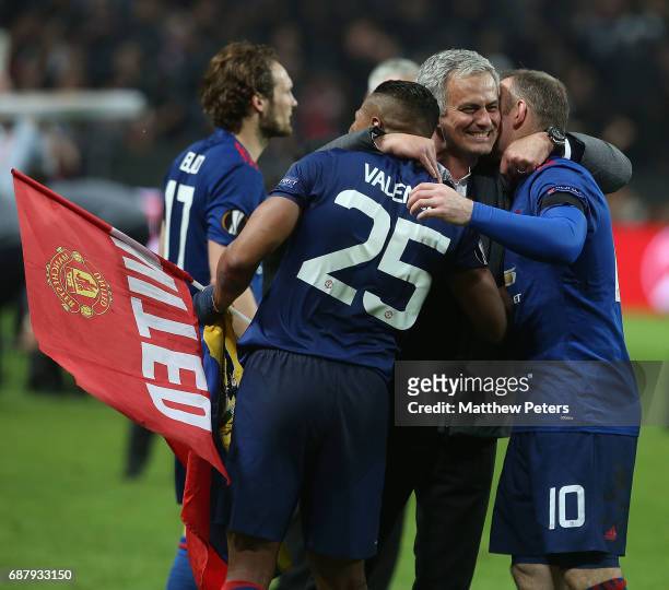 Manager Jose Mourinho of Manchester United celebrates with Antonio Valencia and Wayne Rooney after the UEFA Europa League Final match between...