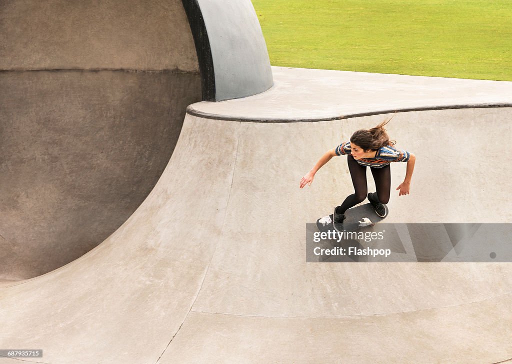 Young woman skateboarding