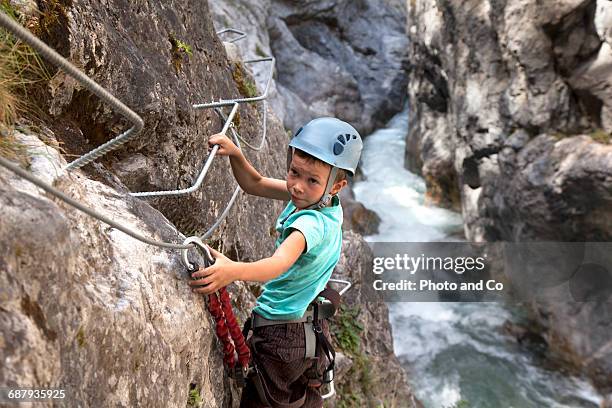 child on via ferrata, climbing - glen haven co stock pictures, royalty-free photos & images