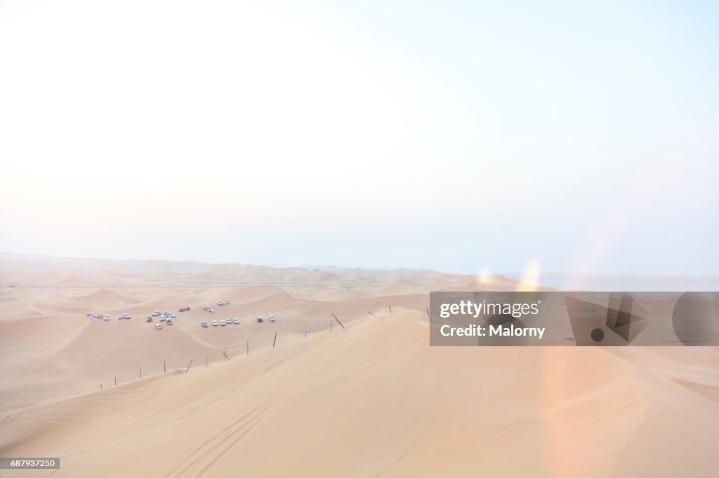 Beautiful sand dunes in the desert at sunset. Lens Flare