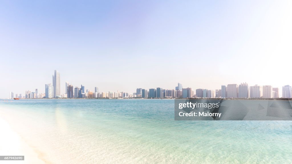 UAE, skyline of Abu Dhabi at the waterfront, beach