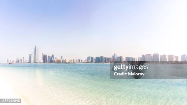 uae, skyline of abu dhabi at the waterfront, beach - abu dhabi skyline stock pictures, royalty-free photos & images