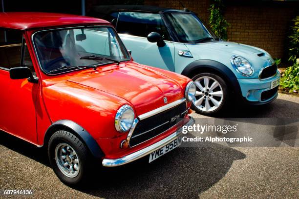 classic und bmw mini coopers - classic car point of view stock-fotos und bilder