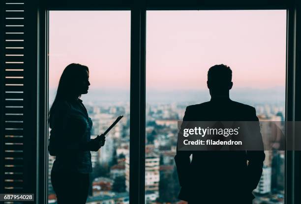 business meeting - 2 businessmen in silhouette stock pictures, royalty-free photos & images