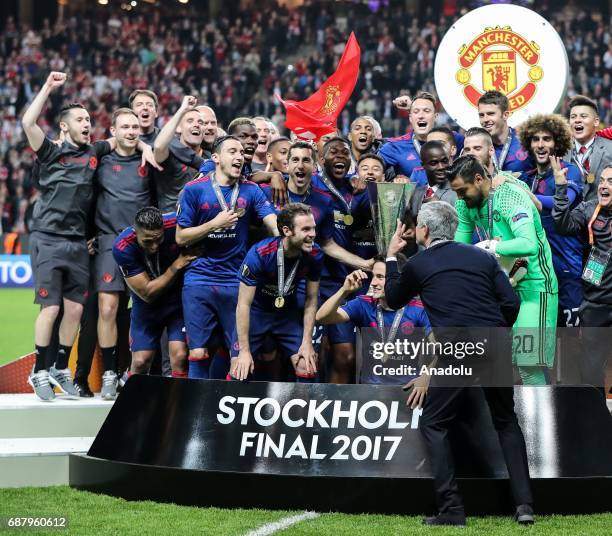 Players of Manchester United celebrate with trophy at the end of the UEFA Europa League Final match between Ajax and Manchester United at Friends...