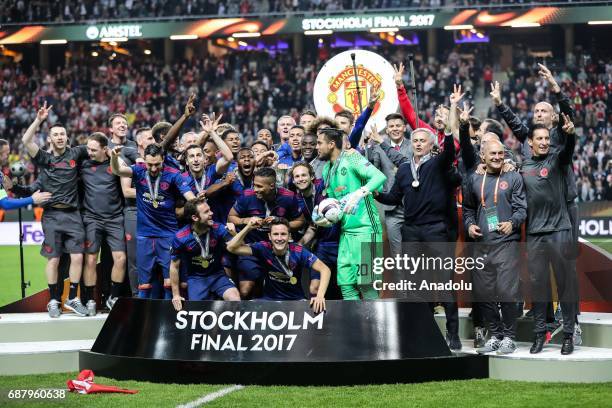 Players of Manchester United celebrate with trophy at the end of the UEFA Europa League Final match between Ajax and Manchester United at Friends...