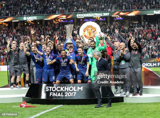 Players of Manchester United celebrate with trophy at the end of the UEFA Europa League Final match between Ajax and Manchester United at Friends...
