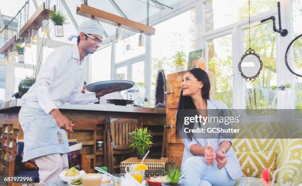 let me clear this food for you madam - tradition stock pictures, royalty-free photos & images