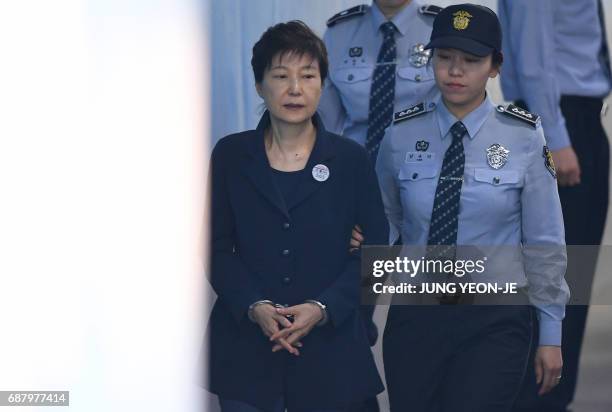 South Korean ousted leader Park Geun-Hye arrives at the Seoul Central District Court in Seoul on May 25, 2017 for her trial over the massive...