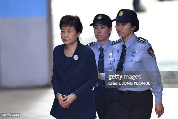 South Korean ousted leader Park Geun-Hye arrives at the Seoul Central District Court in Seoul on May 25, 2017 for her trial over the massive...