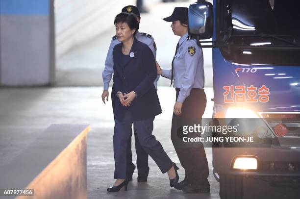 South Korean ousted leader Park Geun-Hye arrives at the Seoul Central District Court in Seoul on May 25, 2017 for her trial over the massive...
