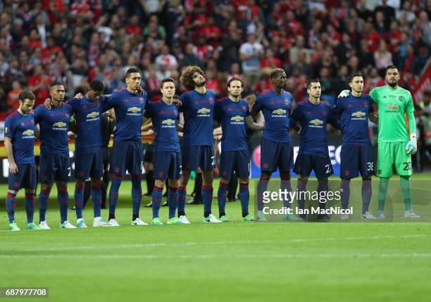 Manchester United players observe a minutes silence during the UEFA Europa League Final match between Ajax and Manchester United at Friends Arena on...