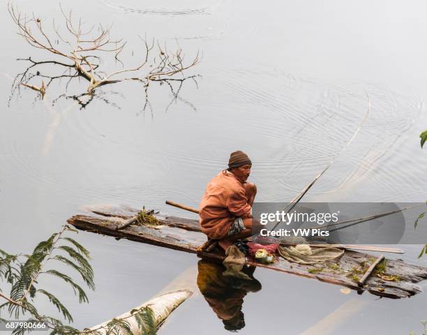 Man fishing in Rana Mese Lake. Flores island. Indonesia, Asia.