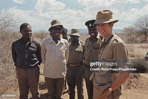 Prince Charles, Prince of Wales pictured with local guides and military escort as he takes part in a four day safari through the Ngare Valley in...