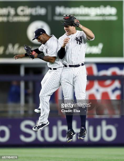 Aaron Hicks and Aaron Judge of the New York Yankees celebrate the 3-0 win over the Kansas City Royals on May 24, 2017 at Yankee Stadium in the Bronx...