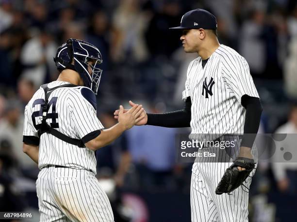 Gary Sanchez and Dellin Betances of the New York Yankees celebrate the 3-0 win over the Kansas City Royals on May 24, 2017 at Yankee Stadium in the...
