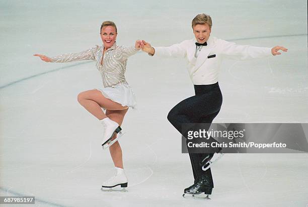 British ice dancers and figure skaters, Jayne Torvill and Christopher Dean pictured performing together on ice during competition at the British Ice...