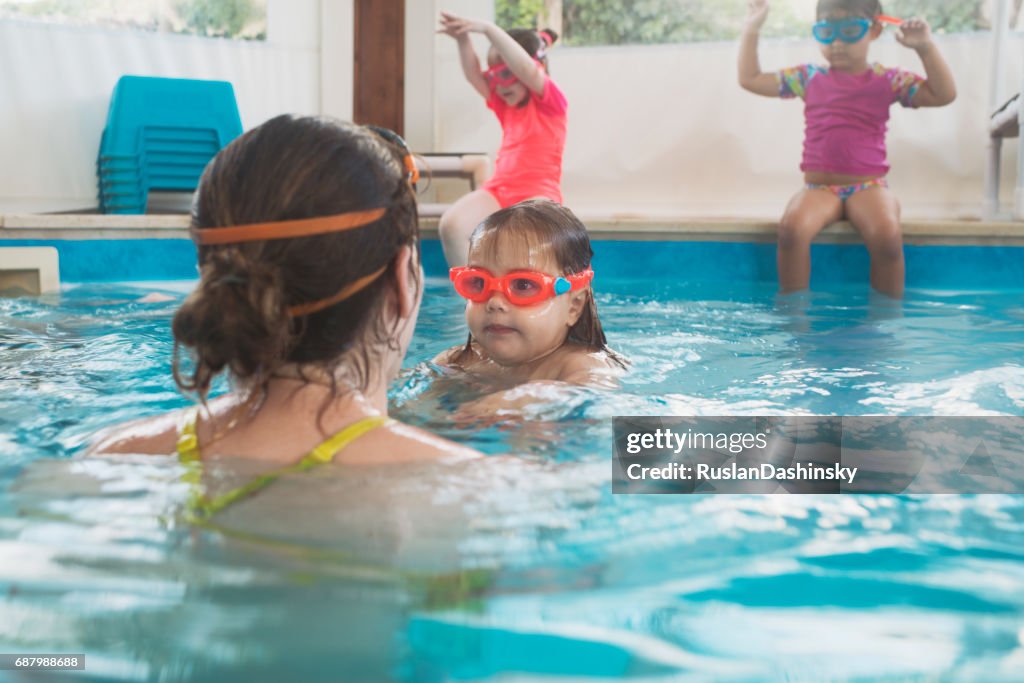 Baby kids swimming lesson.