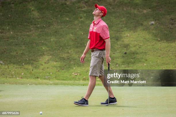 Ferris State University golfer Ben Cook looks displeased with a putt during individual play during the DII Championship. Chandler Blanchet of the...