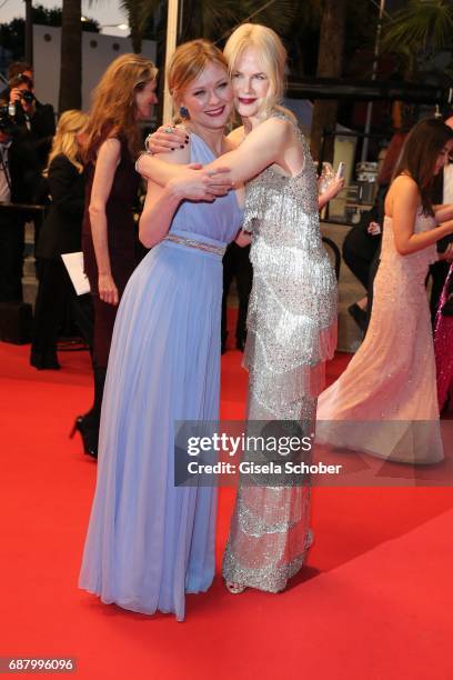 Kirsten Dunst and Nicole Kidman depart the 'The Beguiled' screening during the 70th annual Cannes Film Festival at Palais des Festivals on May 24,...