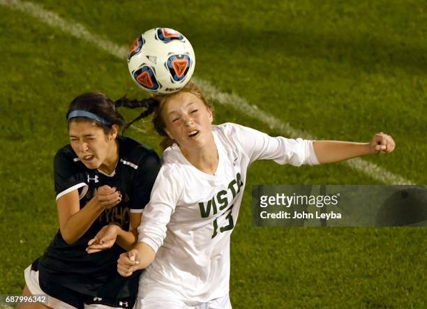 Arapahoe Danielle Babb and Mountain Vista Hannah Joella go up for the ball in the second half during the 2017 CHSAA Girls Soccer State Championship -...