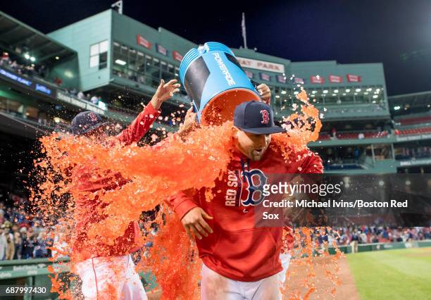 Sam Travis of the Boston Red Sox is showered with Powerade after collecting two hits in a 9-4 win over the Texas Rangers in his Major League debut at...