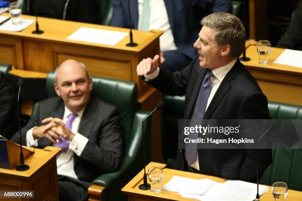 Prime Minister Bill English speaks while Finance Minister Steven Joyce looks on during the 2017 budget presentation at Parliament on May 25, 2017 in...