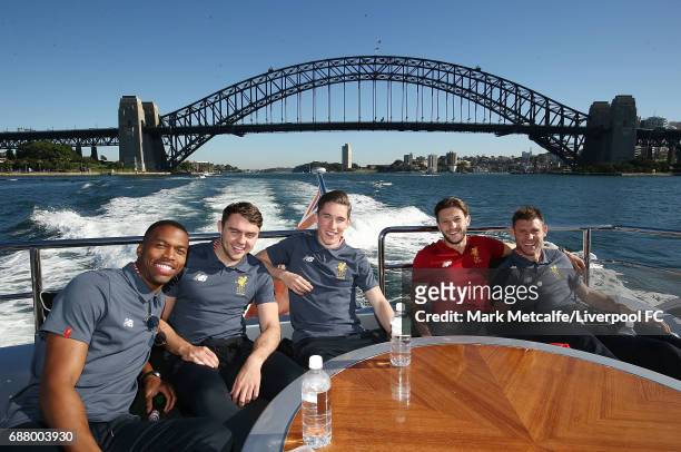 James Milner, Daniel Sturridge, Adam Lallana, Harry Wilson and Connor Randall pose on Sydney Harbour during a Liverpool FC player visit to Taronga...