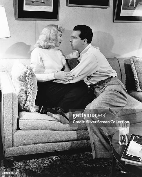 Actors Fred MacMurray as Walter Neff and Barbara Stanwyck as Phyllis Dietrichson in the film 'Double Indemnity', directed by Billy Wilder, 1944.