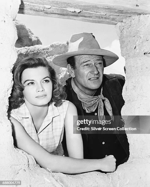 Actors Angie Dickinson and John Wayne star in the western 'Rio Bravo', 1959.