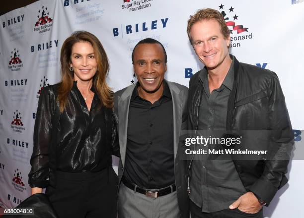 Cindy Crawford, Sugar Ray Leonard, and Rande Gerber attend the B. Riley & Co. 8th Annual "Big Fighters, Big Cause" Charity Boxing Night benefiting...